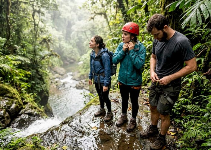 Adventure travelers gearing up at Jacó waterfall