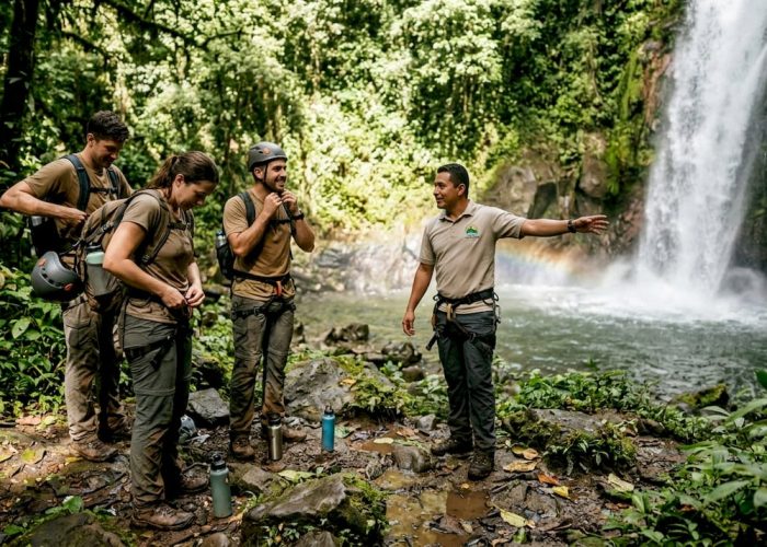 Adventurers gearing up by Costa Rica waterfall