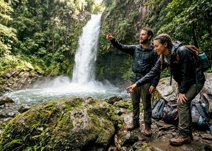 Hikers and guide at Costa Rican waterfall