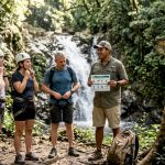 Adventure guide briefing group by Jacó waterfall